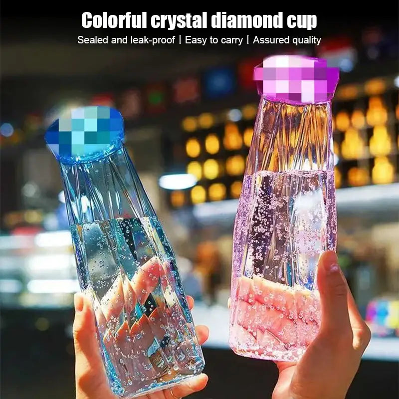 Modern blue diamond water bottle with colorful faceted crystal body and vibrant blue or purple sealed lid for travel