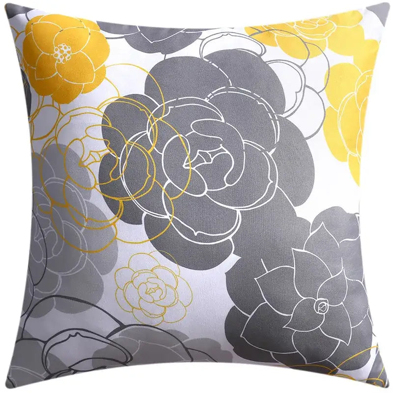 Modern blue floral cushion cover featuring bold yellow and gray blossoms on light background for living room decorbites decor