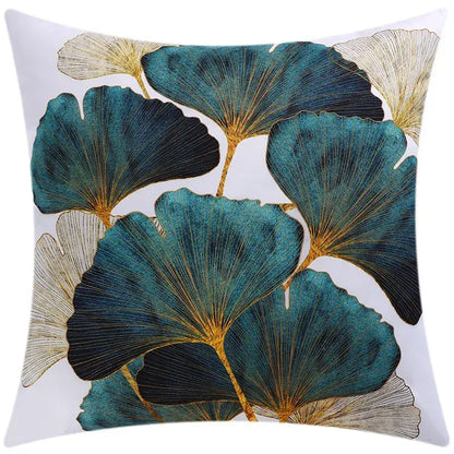 A square cushion cover with embroidered teal black and gold ginkgo leaves on white for decorbites blue floral decor