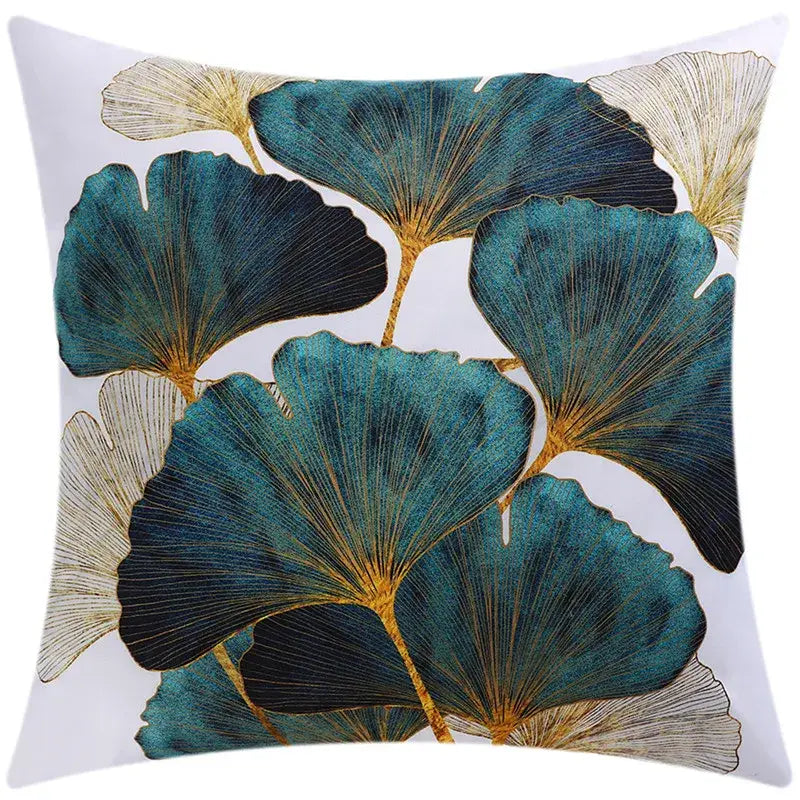 A square cushion cover with embroidered teal black and gold ginkgo leaves on white for decorbites blue floral decor