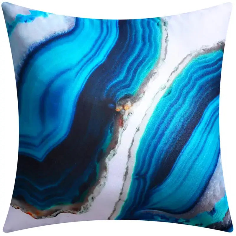 Square throw pillow with vibrant blue floral cushion cover featuring agate-like teal, navy, and gray layers for decorbites decor
