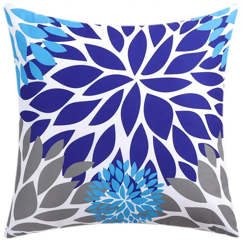 Square cushion cover with bold stylized blue floral pattern on white background for modern living room decorbites decor