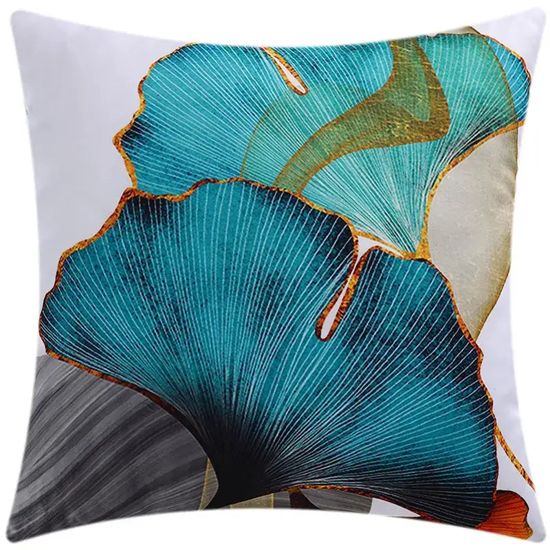 Modern blue floral cushion cover featuring vibrant teal and gold ginkgo leaves for living room decorbites decor