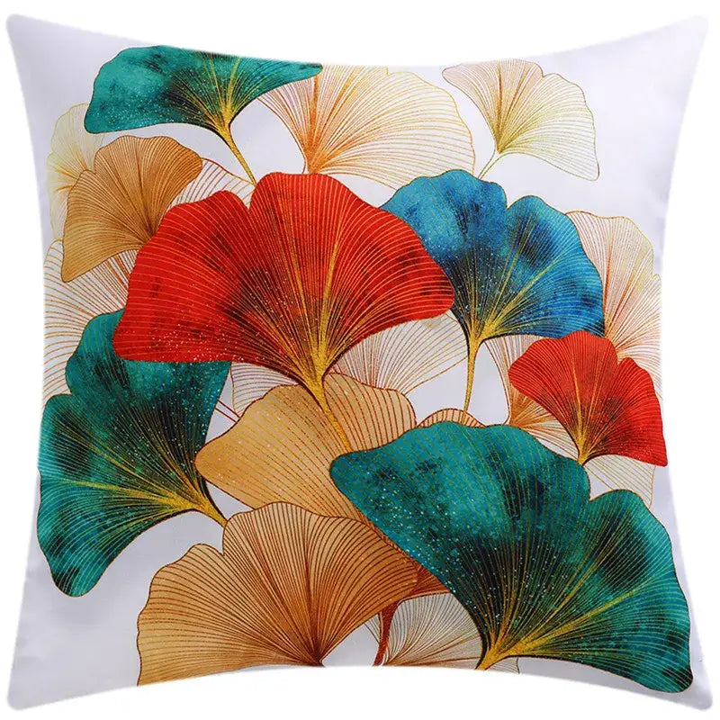 Modern blue floral cushion cover featuring a vibrant multicolored ginkgo leaf pattern with teal red and gold accents