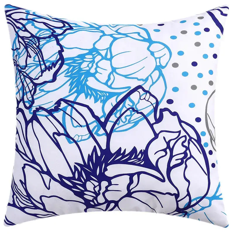 White cushion cover with bold blue floral outline and light blue gray polka dots for modern living room decorbites decor