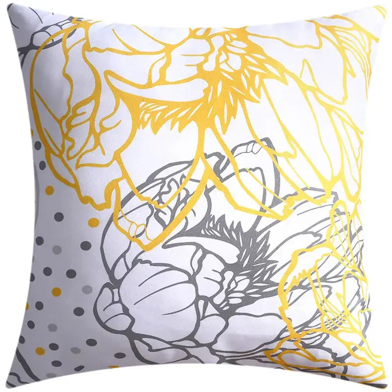 White throw pillow with bold yellow and gray floral outlines and polka dots in blue floral cushion cover decorbites set