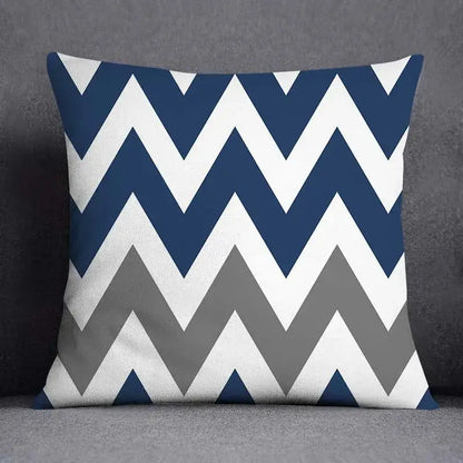 Square throw pillow with bold navy blue white and gray chevron pattern featuring modern geometric floral design