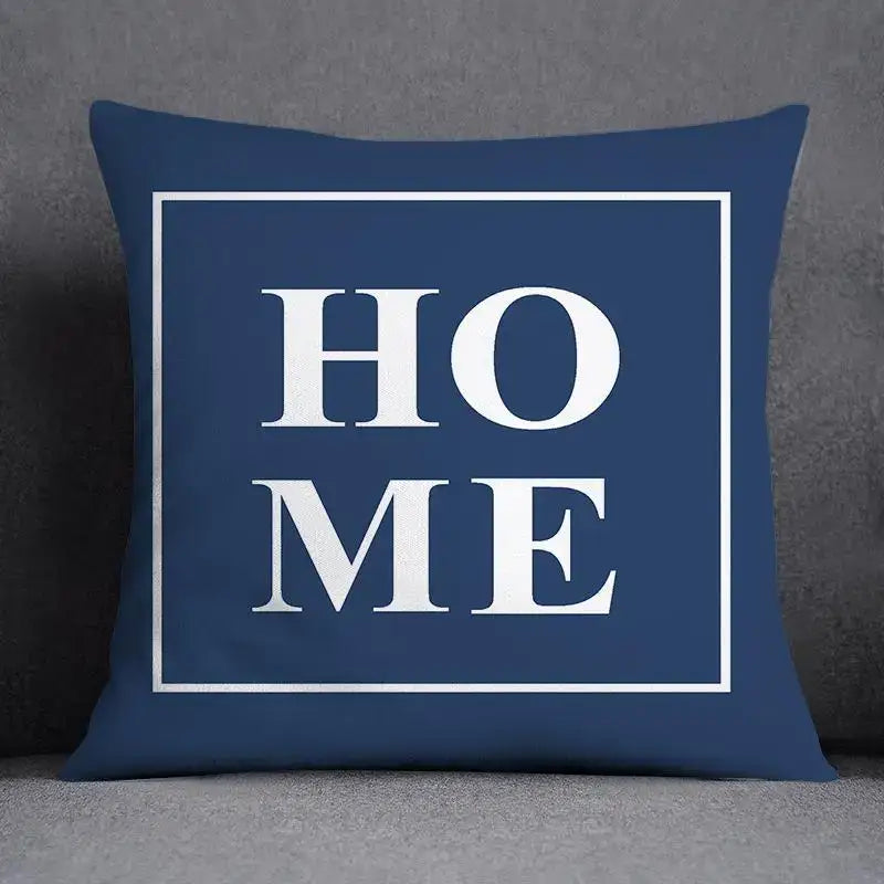 Navy blue square pillow with home in bold white letters and modern geometric floral design for living room cushion