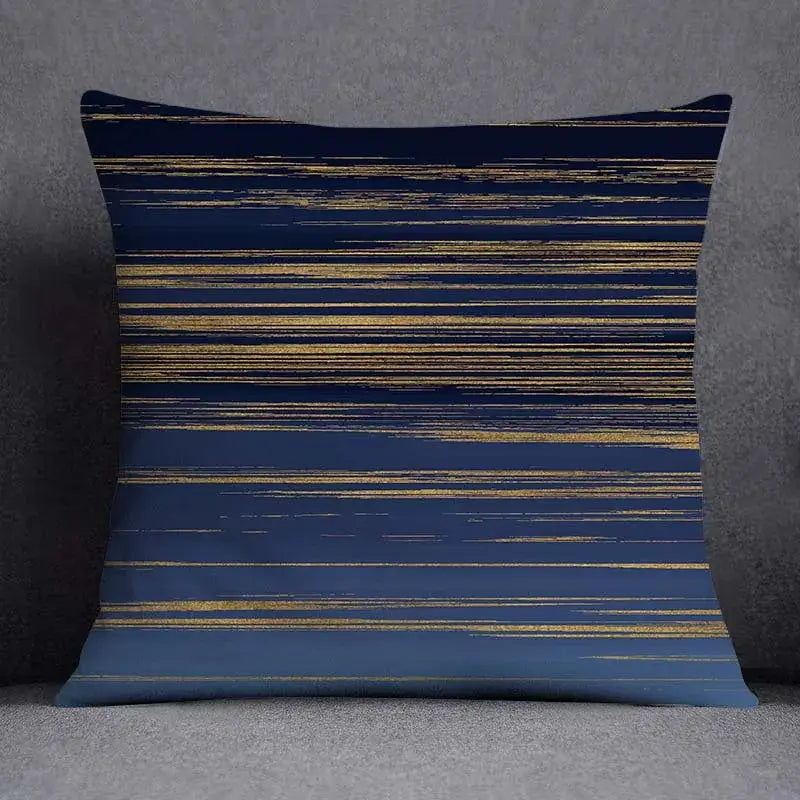 Navy blue throw pillow with horizontal gold foil streaks featuring a modern geometric floral design for living room
