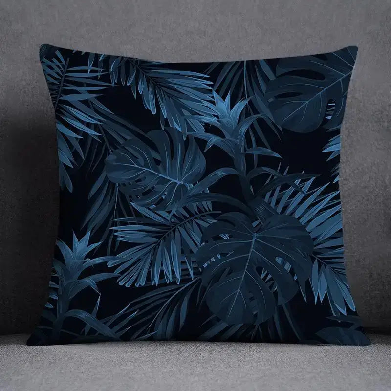 Square throw pillow with dark navy background and intricate teal blue geometric floral design for living room use
