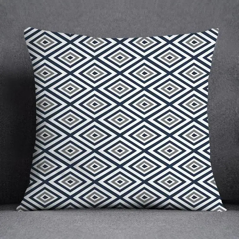Square throw pillow with modern geometric floral design in navy blue white and gray for living room decor