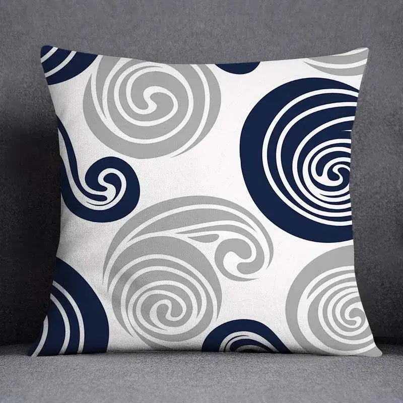 Square throw pillow with modern blue geometric floral design featuring swirling navy blue and gray circles on white background