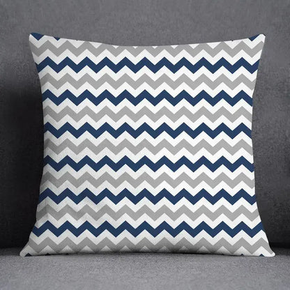 Square throw pillow with bold navy blue light gray and white chevron pattern featuring a modern geometric floral design