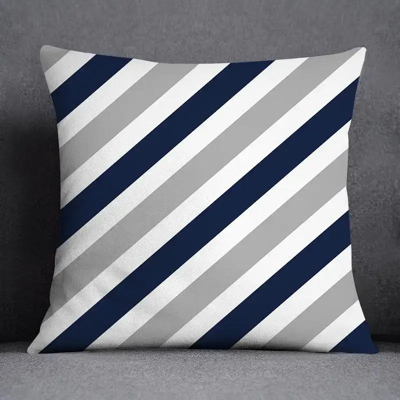 Square throw pillow with navy blue white and light gray diagonal stripes featuring a modern geometric floral design