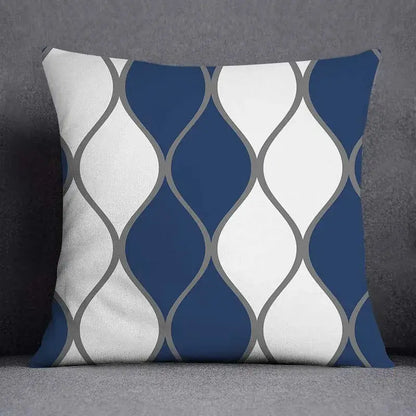 A square throw pillow with a modern blue geometric floral design in navy blue white and gray for living room use