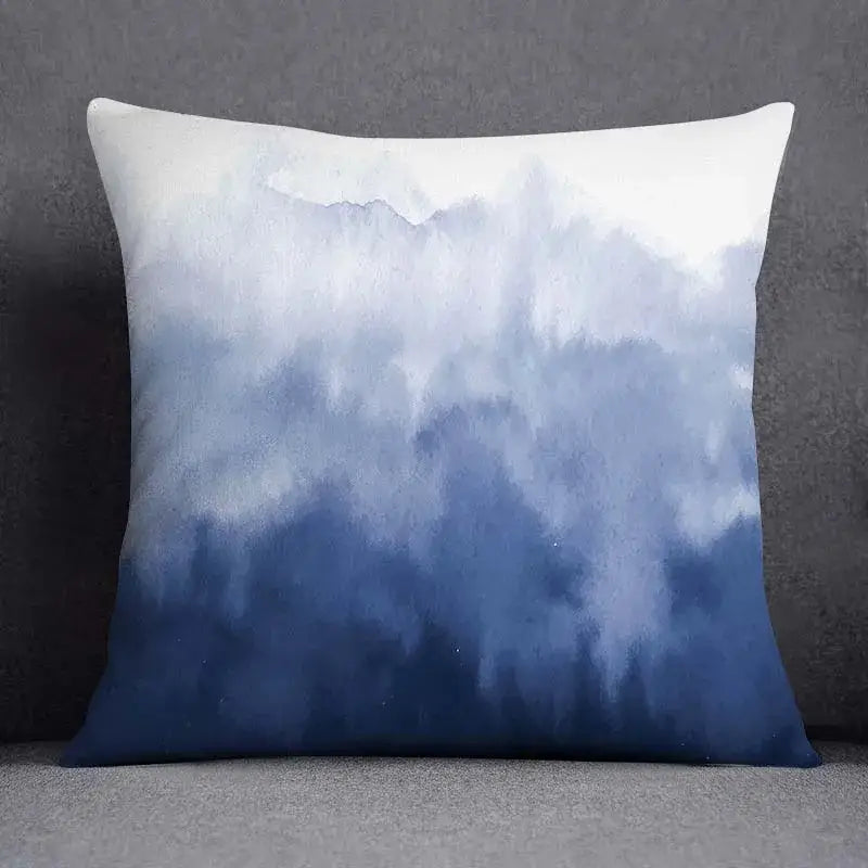 Modern blue geometric floral design square cushion with watercolor gradient from white to deep blue for living room