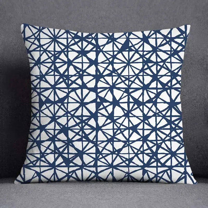 Modern blue geometric floral design pillowcase with bold navy blue pattern on white for living room cushion