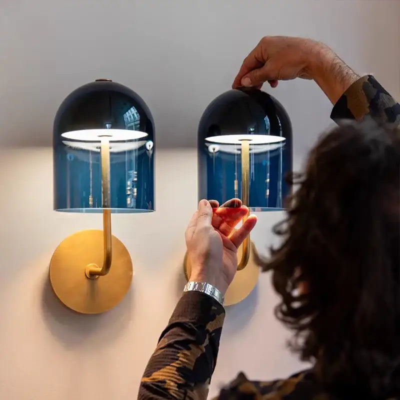 Modern blue glass dome wall sconce lamps with gold-toned metal bases ideal for bedroom lighting as sconce lamps