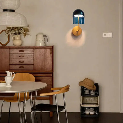 Modern blue glass dome wall sconce lamp with gold-toned circular base ideal for bedroom wall sconce lamps lighting