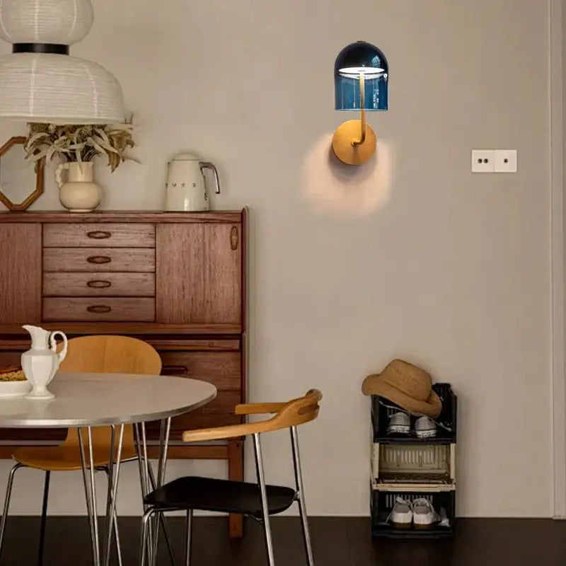 Modern blue glass dome wall sconce lamp with gold-toned circular base ideal for bedroom wall sconce lamps lighting