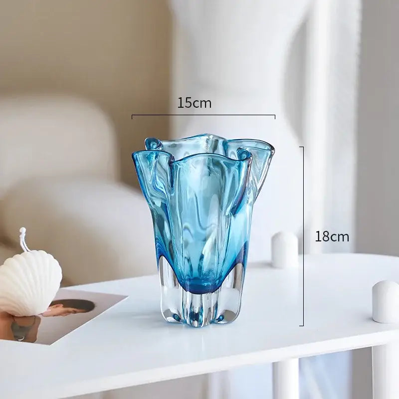 Modern blue glass hydroponic vase with a translucent wavy rim and faceted base for office desk decorbites decor