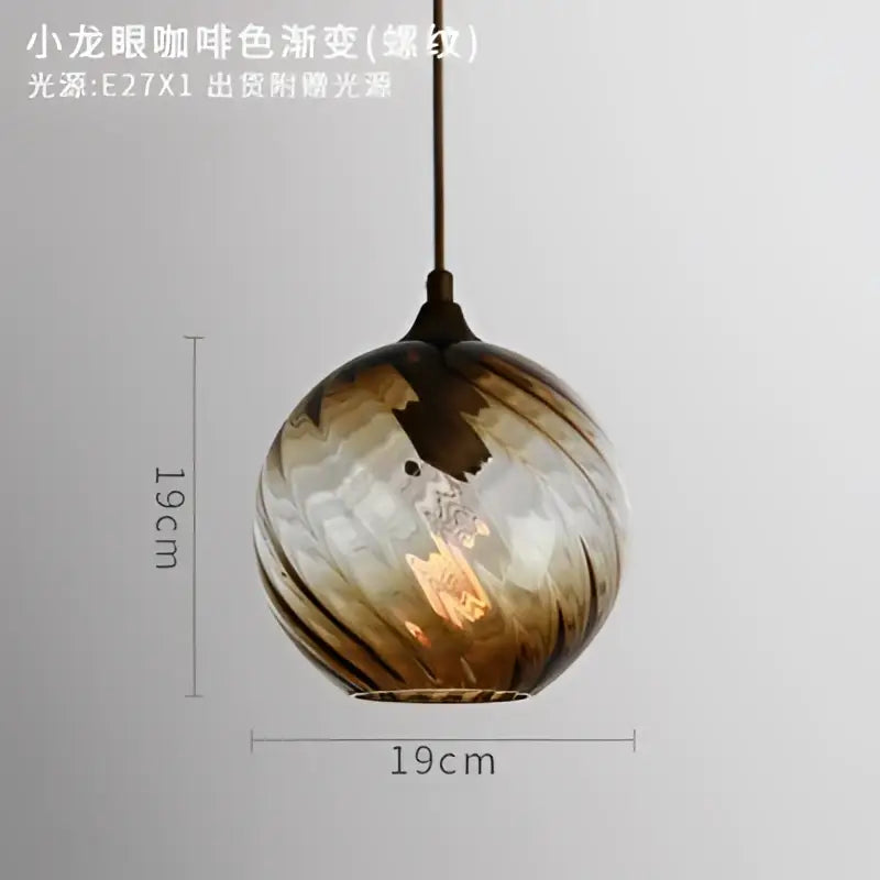 Modern blue glass led pendant lamp featuring a spherical amber and brown glass led pendant with exposed filament bulb