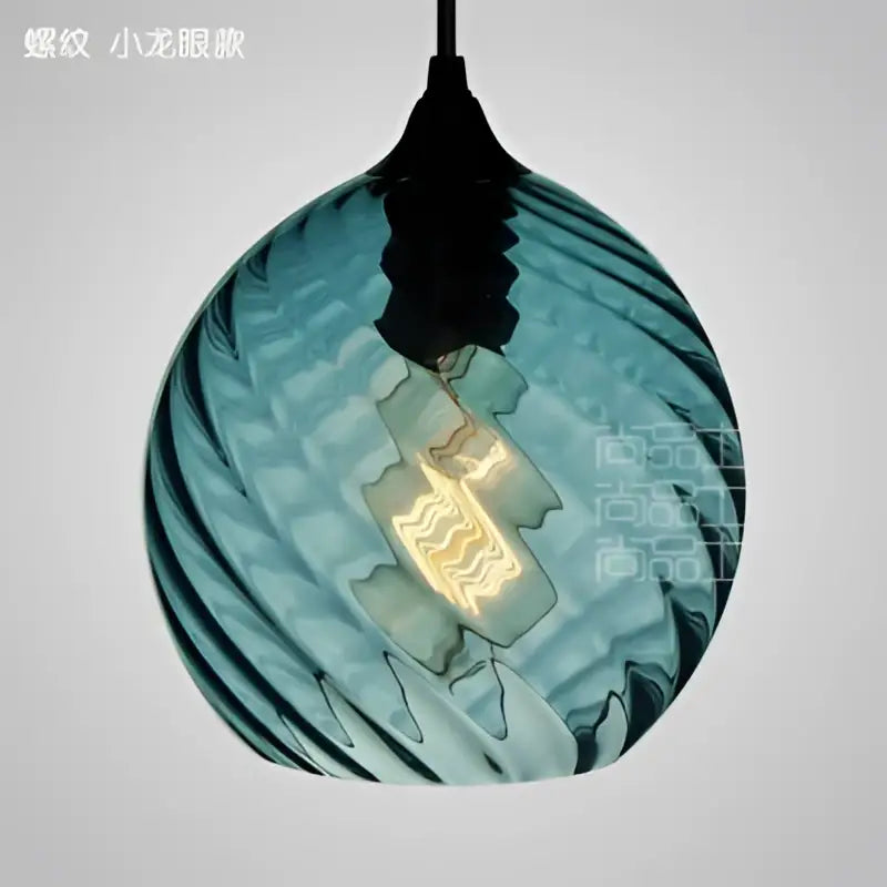 Teal glass led pendant lamp with twisted ribbed design and exposed filament bulb for modern dining room lighting