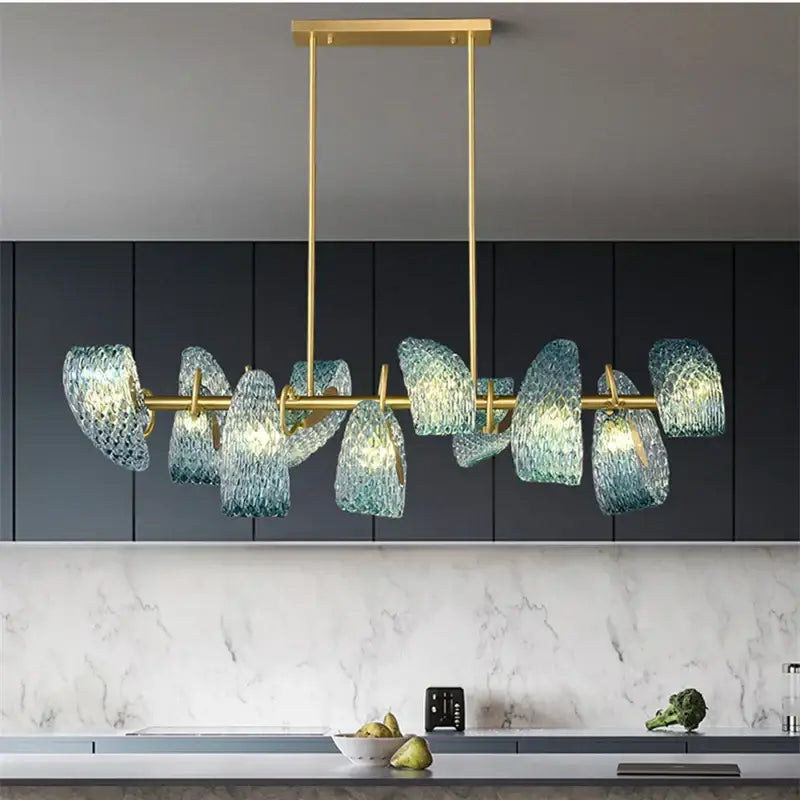Modern pendant lamps with gold-toned frame and decorbites blue glass led shades for dining room decor