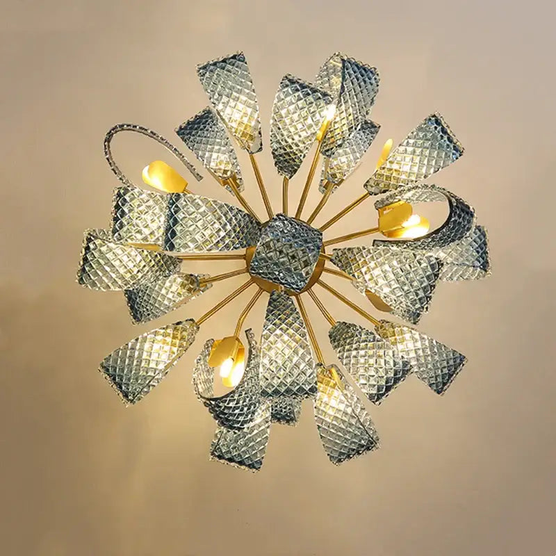 Modern pendant lamps featuring a brass hub with faceted silver blue glass led petal shades for dining room decorbites blue glass