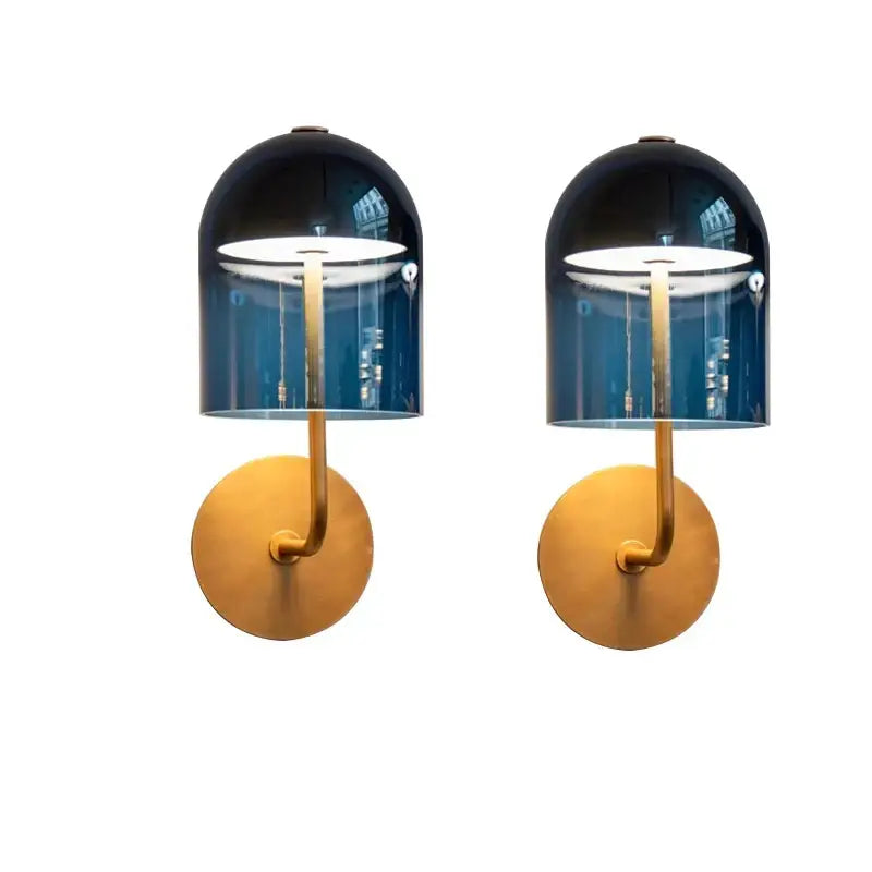 Pair of modern wall lamps with decorbites blue glass domes and brass bases for elegant bedroom blue glass wall decor