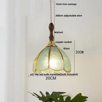 Modern blue and gold butterfly glass led pendant light with a textured green glass shade and brass accents decorbites butterfly glass pendant light