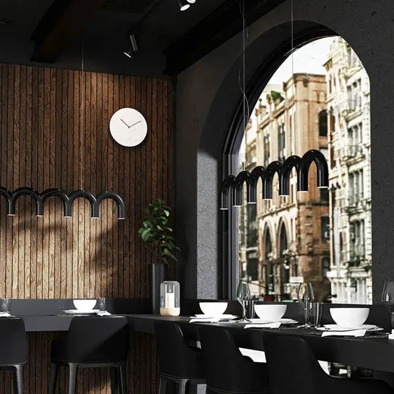 Black arched pendant lights of decorbites blue metal arch chandelier hanging above a dining table for modern kitchen decor
