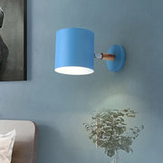 Modern blue metal tubular wall lamp with wooden arm sconce light ideal as a bedroom inch fixture