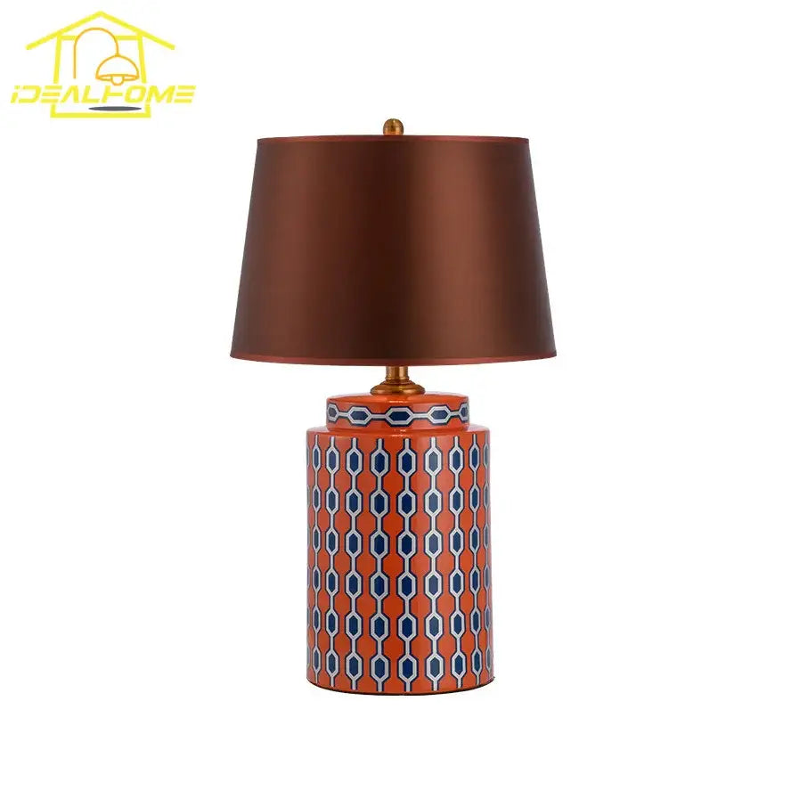 Modern blue orange ceramic table lamp with orange base geometric blue white pattern and brown satin shade for bedroom use