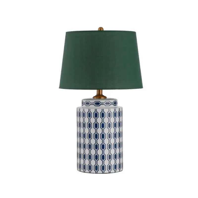 Modern blue orange ceramic table lamp with white ceramic base, blue geometric pattern, dark green shade, and brass hardware