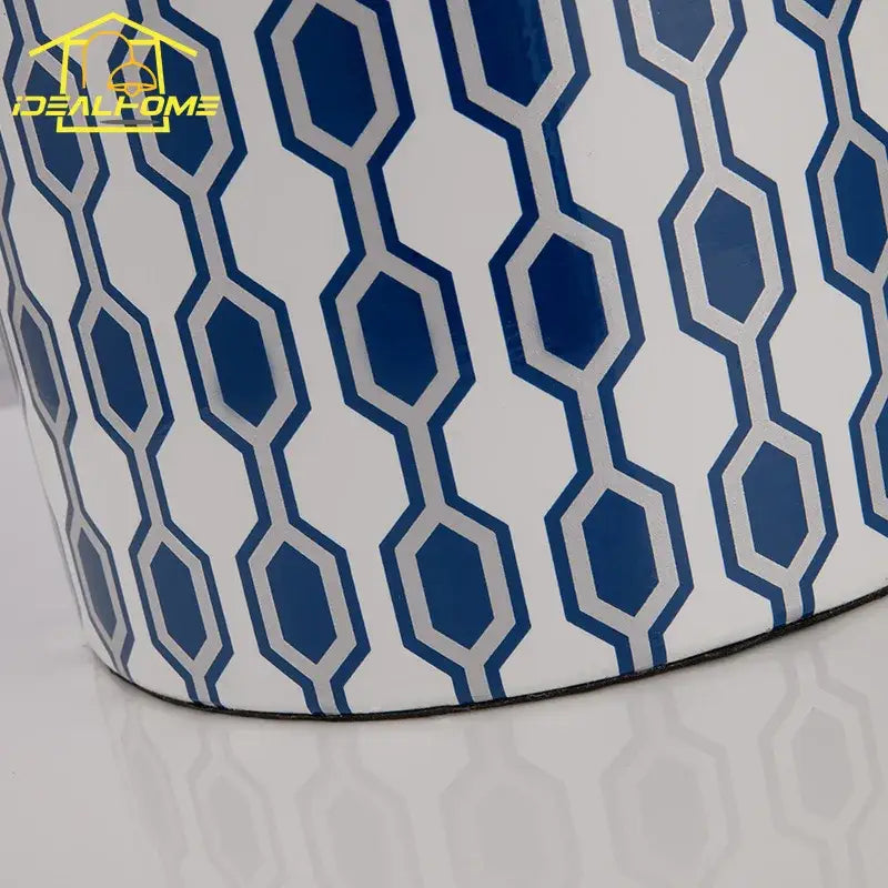 Modern blue orange table lamp with a blue and white geometric ceramic planter featuring a glossy finish for decorbites blue orange decor