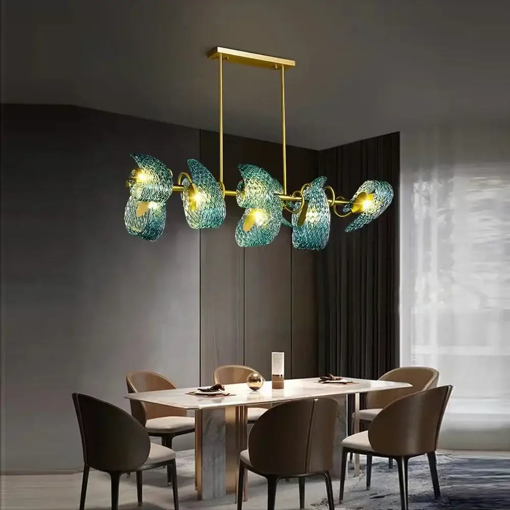 Modern blue peacock leaf glass chandelier with five teal glass shades and gold-toned metal arms for dining room decorbites blue peacock
