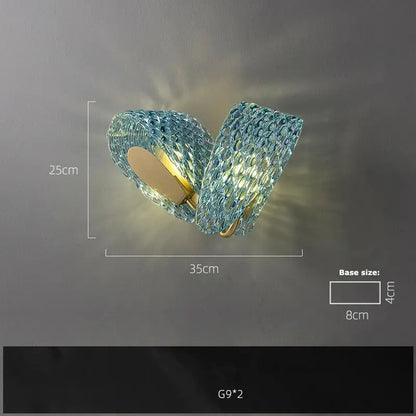 Modern blue queen crystal glass wall sconce featuring textured blue glass and gold-toned metal base for decorbites blue queen