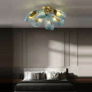 Modern blue queen crystal glass petal chandelier with gold base and translucent blue petals for bedroom decorbites blue queen