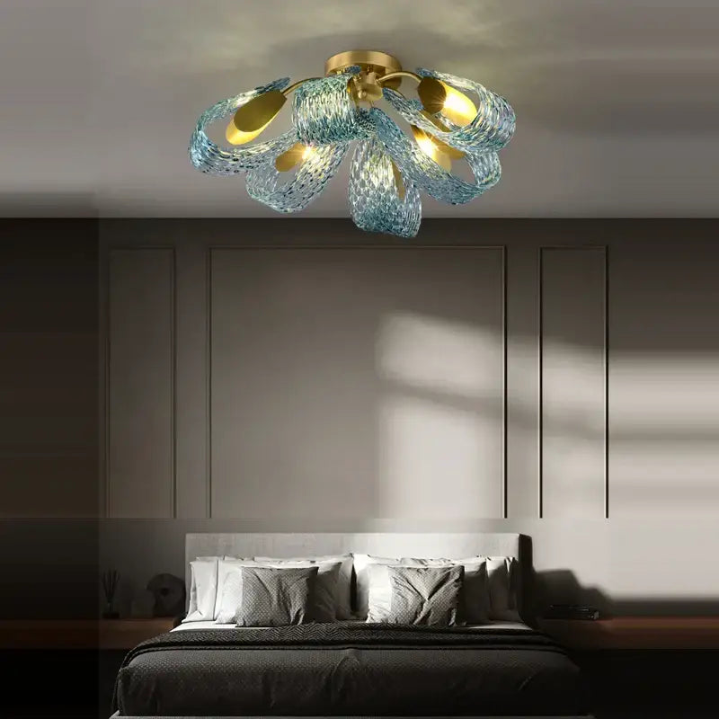 Modern blue queen crystal glass petal chandelier with gold base and translucent blue petals for bedroom decorbites blue queen