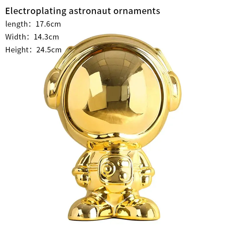 Shiny gold electroplated decorbites astronaut statue with reflective helmet and detailed suit for living room decor