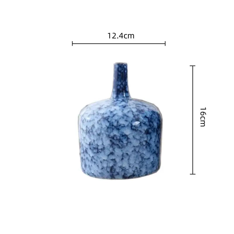 Modern blue speckled ceramic vase with slender neck and rounded body for living room decorbites blue ceramic accents