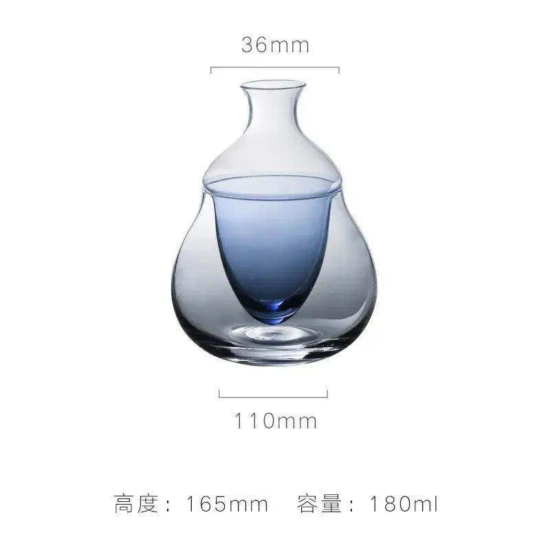 A sleek transparent glass wine pot with gradient blue interior and slender neck ideal as a wine pot ice jug