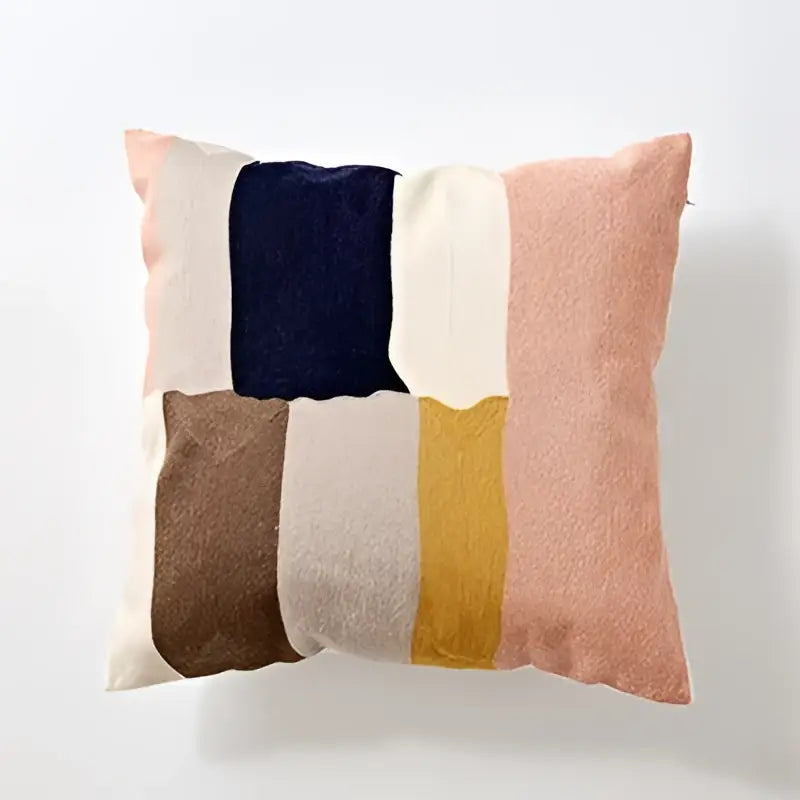 Soft modern patchwork cushion cover with muted pink, navy, cream, mustard, and brown embroidered geometric cotton design