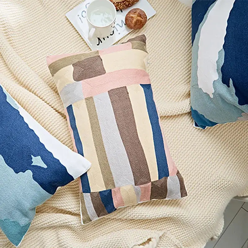 Rectangular cushion cover with embroidered geometric cotton patchwork in soft pastel and earthy tones for bedroom use