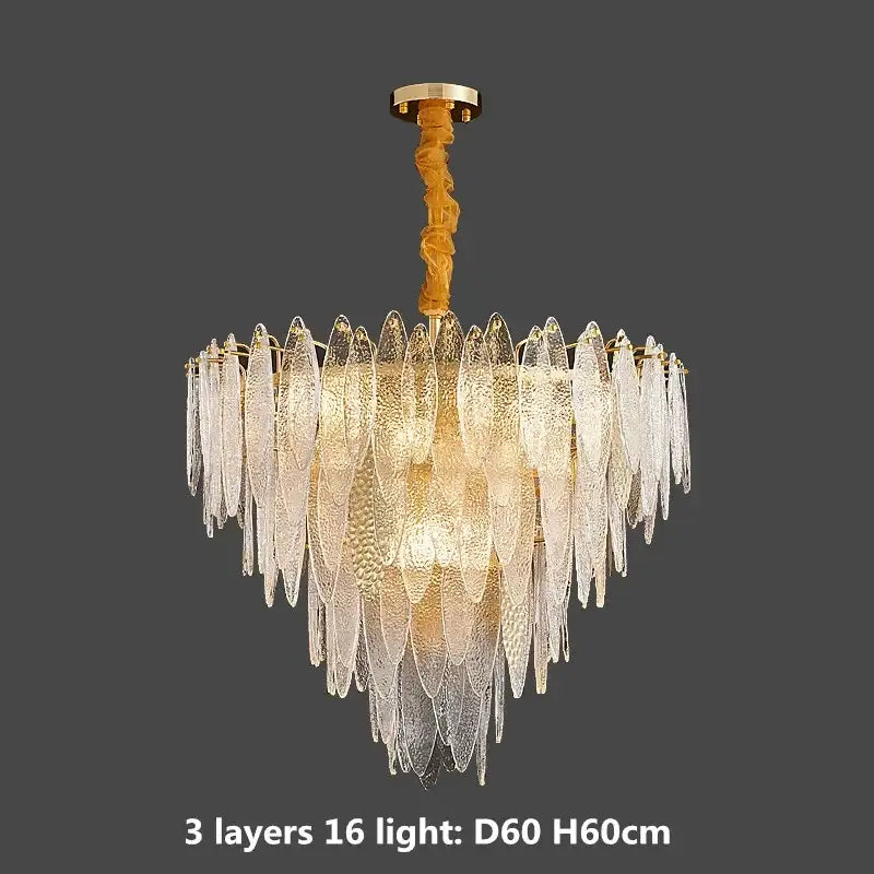 A multi-tiered pendant light with translucent textured glass leaves on a decorbites gold metal chain frame
