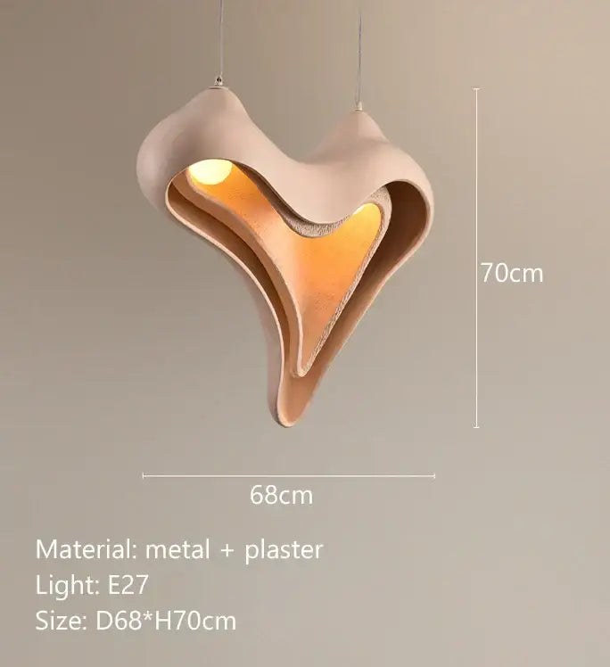 A modern blush pink ceramic pendant light with sculptural metal and plaster design for dining room decorbites conch chandelier