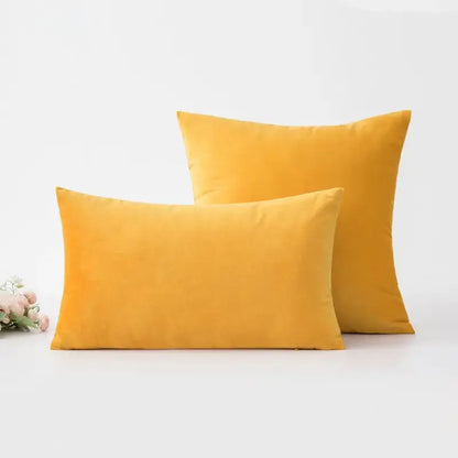 Two mustard-yellow velvet throw pillows with modern boho golden yellow geometric cushion cover and tassel decorbites design