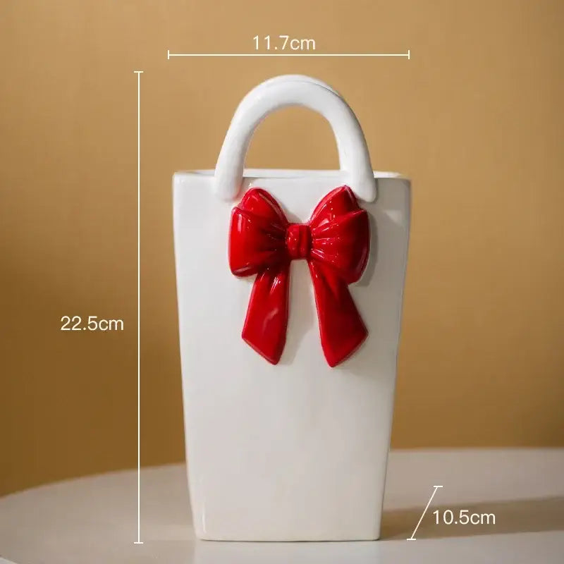 White ceramic bowknot ceramic vase handbag with a glossy red bow and white handle for modern decorbites decor