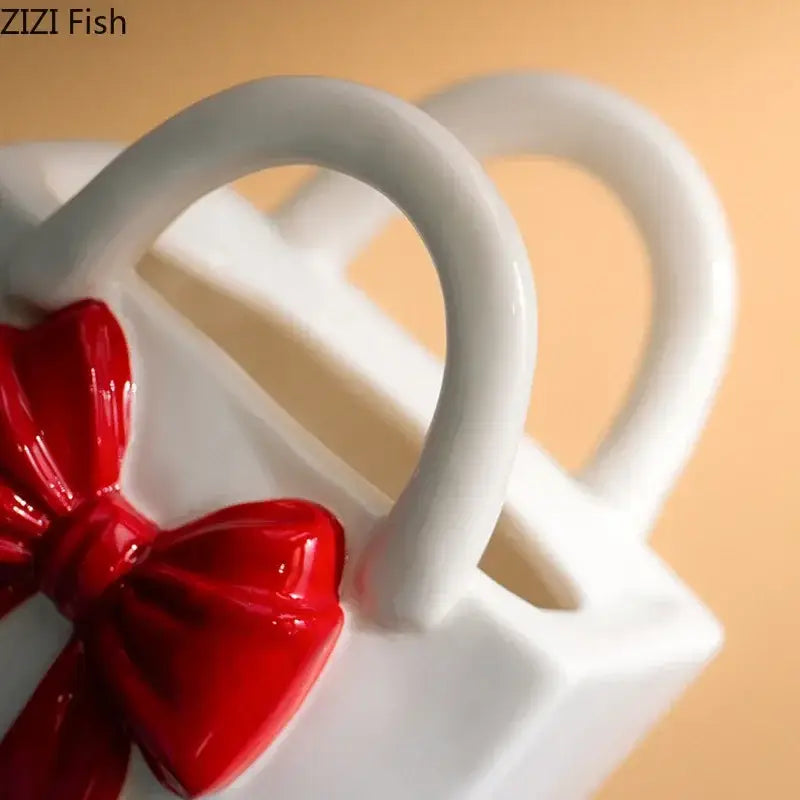 White ceramic ceramic vase handbag with glossy red bow accent for modern decorbites bowknot ceramic decor